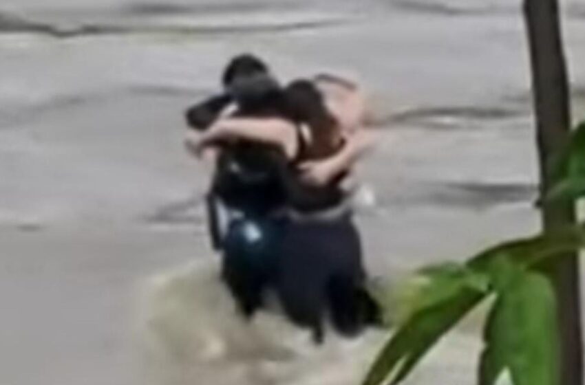  Friends seen in ‘final embrace’ before being swept away by flood