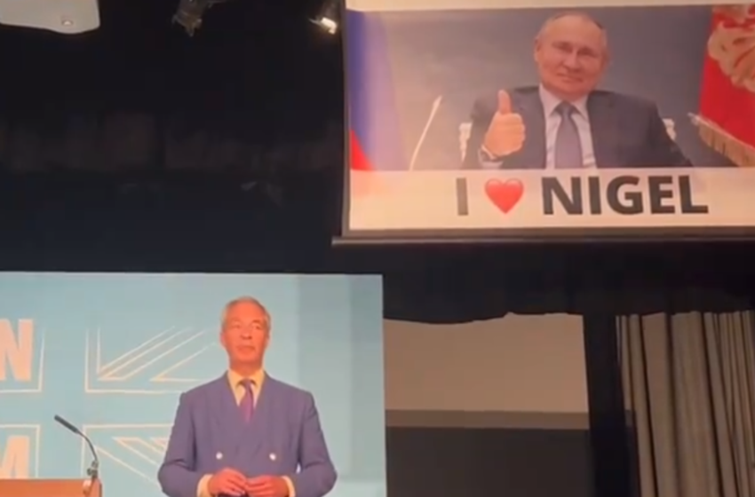  Nigel Farage speech interrupted by banner showing smirking Putin