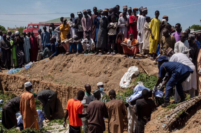  Mass burial after more than 140 killed scooping up fuel from overturned petrol tanker