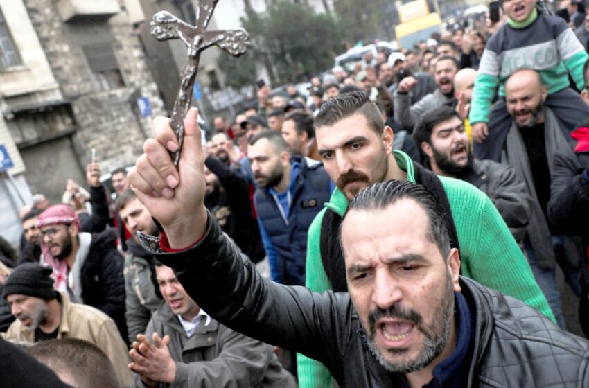 protests-break-out-as-hooded-fighters-torch-christmas-tree-in-syria