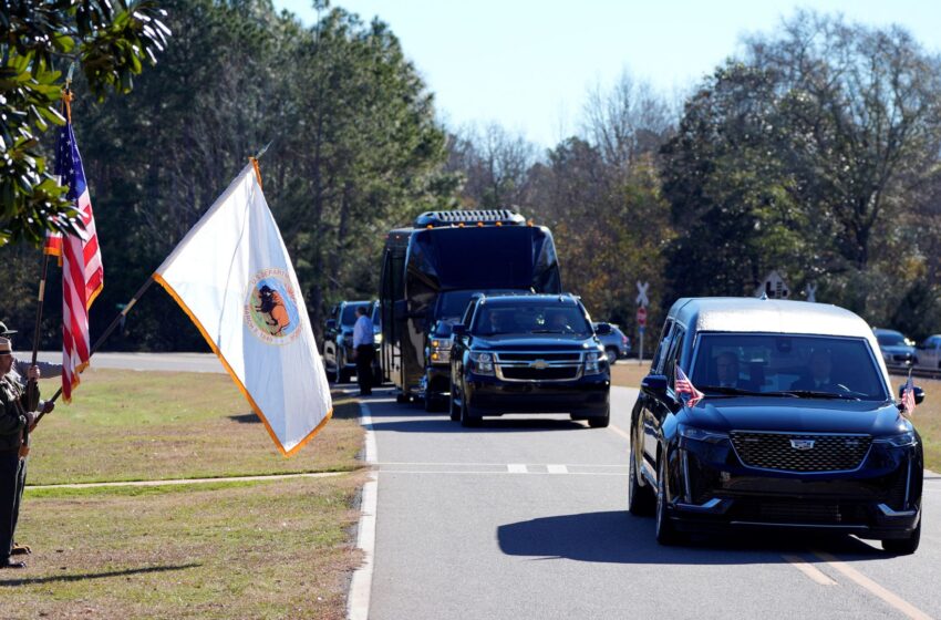  Jimmy Carter’s six-day state funeral starts with procession – as mourners gather for service